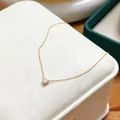 Elegant gold plated stainless steel necklace with a heart shape birthstone pendant - April Crystal White