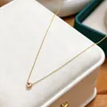 Dainty gold stainless steel necklace featuring a sparkling pink heart-shaped birthstone pendant. - October Tourmaline Pink
