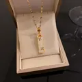 Close-up of elegant gold bamboo joint pendant necklace with white stone and crystals - White Bamboo Necklace (Lip Chain) / White