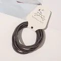 Close-up detail view of high elasticity thin hair bands in dark grey on display card - 10 Pieces/Pack / Dark Gray