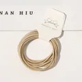 Macro detail of beige high-elastic hair ties presented on a clean white cardboard tag - 10 Pieces/Pack / Khaki
