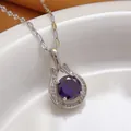 Detailed macro shot of a silver-toned necklace pendant featuring a large purple gemstone - Drop Swan Neck Style (288+Lips Chain)