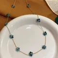 Elegant gold chain necklace featuring blue crystal flower charms for women - Necklace (86637) / Blue