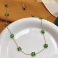 Gold stainless steel necklace featuring elegant green crystal flower charms - Necklace (86638) / Green