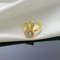 Detail of a gold-plated rabbit ring with shimmering CZ stones and shell-like ear accents. - Spinning Rabbit Gold Ring (TJ44) / Gold