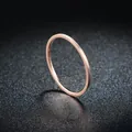Close-up of minimalist rose gold slim titanium steel ring on glitter background - Size 5 / Rose Gold