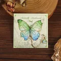 Elegant butterfly metal bookmark with green gradient wings and heart pendant on card. - 1 Piece / Eternal Butterfly Dream