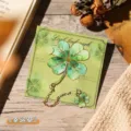 Exquisite gilded metal four-leaf clover bookmark with hanging charm on a green card - Clover (W883) / 1 Piece
