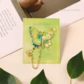 Elegant green butterfly metal bookmark with lily of the valley and gold chain detail. - 1 Piece / Green (Prosperous Green)
