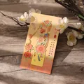 Elegant gilded metal bookmark with phoenix and peony design presented on decorative card - Phoenix & Peony