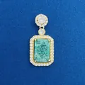 Elegant rectangular emerald green pendant with halo of white stones on blue background. - Green Rectangular Pendant (791) / Pendant Only (Without Chain) / Gold
