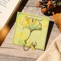 Ginkgo leaf metal bookmark with gold chain presented on a green decorative gift card - Gold-Green Gradient Ginkgo