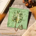 Elegant metal monstera leaf bookmark with chain and decorative gold trim detail - Green Monstera Leaf