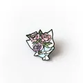 Floral bouquet enamel pin featuring pink and purple roses in a blue wrap - Rose