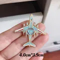 Detailed close-up view of a blue and gold fighter aircraft metal pin badge held by hand - KJ-2000 Main Ring AWACS Style (6036930842064)