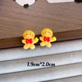 Macro detail of cute yellow gingerbread man Christmas earrings with size dimensions - Gingerbread Man B (YJ89651) / 925 Sterling Silver Pin Stud Earrings