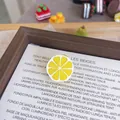 Detailed view of a realistic 3D resin lemon fruit brooch pin for clothing accessories - Lemon