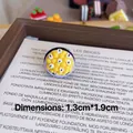 Detailed macro view of a handmade passion fruit resin brooch pin measuring 1.3x1.9cm - Small Passion Fruit