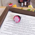 Detailed close-up view of a cute mangosteen-inspired resin fruit brooch pin badge - Mangosteen