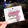 Set of two gummy heart gradient hair clips in glittery pink on white display card - Heart Set (Headband & Comb) / Purple Gradient