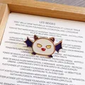Detail of a cute white and purple Halloween bat enamel pin brooch on aesthetic background - Bat