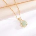 Elegant golden fortune bag pendant necklace with a round light green Hetian jade stone - Lucky Bag O-Chain Style / Gold