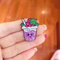Close-up of a cute purple cartoon bubble tea enamel pin with fruit toppings. - Grape Fruit Tea