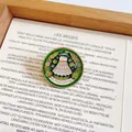 Macro detail of a creative shuttlecock enamel pin featuring a St. Patrick's Day theme - Badminton