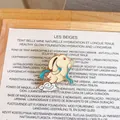 Detailed macro shot of an elegant Chinese-style rabbit enamel pin on a white cloud - Rabbit with Ribbons on Cloud (YJ005)
