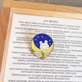 Detailed close-up of a cute rabbit on crescent moon enamel pin brooch with flowers - Rabbit on Yellow Crescent (YJ008)