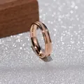 Detailed close-up of rose gold frosted titanium steel ring with elegant polished edges - Size 5 / Rose Gold