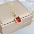 Detailed view of luxury gold necklace with a large rectangular red gemstone pendant - Necklace / Gold Ruby Style Necklace