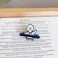 Macro detail of a cute cartoon white duck brooch playing a black keyboard synthesizer. - Electronic Organ Duck