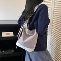 Lavender-grey color-contrast canvas tote bag worn by a model for a casual look. - Color Block Bag Set / Gray