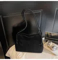 Close-up of a large black suede tote bag with elegant shoulder straps and props - No Pendant / Black
