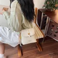 Elegant beige tweed bucket crossbody bag with a gold heart buckle and charm for women - Basic Style / Off White