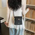Stylish black and grey plaid crossbody bucket bag for women with gold heart buckle - Basic Style / Black