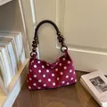 Vintage style burgundy polka dot shoulder bag with unique wooden bead handle strap. - Red