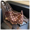 Stylish brown polka dot suede shoulder bag featuring a wooden bead handle and pom-pom - Coffee with Pendant