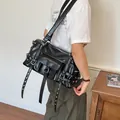 Stylish black faux leather shoulder bag featuring chic punk rivets and metal buckle details - Black