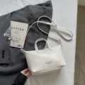 Premium white woven faux leather tote bag with top handle and crossbody strap - Off White