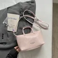 Elegant light pink hand-woven leather tote bag with adjustable strap for women's commuting - Pink