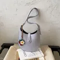 Minimalist lavender hobo shoulder bag featuring a cute strawberry charm and flower detail - With Pendant / Purple
