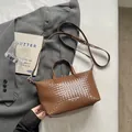 Retro brown woven leather tote bag with adjustable shoulder strap for daily commute - Brown