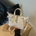Elegant white woven tote bag with pearl lace charms and silver chain detail for women - Off-White With Pendant