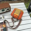 Stylish lightweight orange plaid fabric crossbody bag featuring a yellow mesh pocket detail - S / Orange