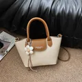 Vintage beige canvas and brown leather handbag for women featuring a white flower charm - With Flower Pendant / White