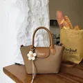Retro brown canvas handbag for women with leather straps and flower charm detail. - With Flower Pendant / Brown