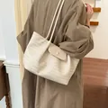 Elegant cream woven faux leather tote bag with flap closure and double shoulder straps for women - White
