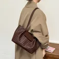 Large capacity dark brown woven leather shoulder bag for women, stylish commuter tote. - Coffee